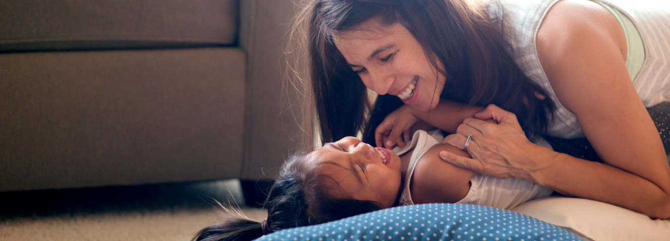 A mother laughing with daughter